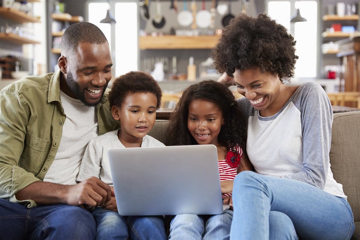 family looking at computer 